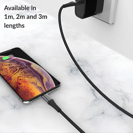 USB-C to iPhone 8-pin braided cable charging a phone at home